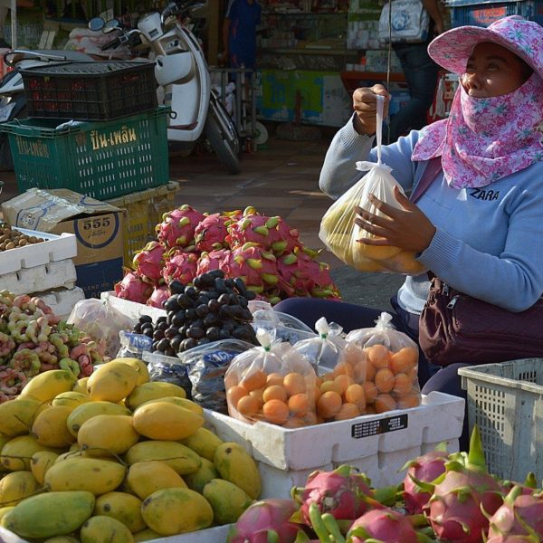 A woman sells fruit in an open air market in Phnom Penh, Cambodia